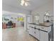 Bright dining area with tile floors and view into adjacent room at 9890 N Balboa Dr, Sun City, AZ 85351