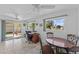 Bright dining area with a table for four and access to a patio at 9890 N Balboa Dr, Sun City, AZ 85351