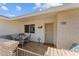 Inviting front entry with patio furniture and brick wall at 9890 N Balboa Dr, Sun City, AZ 85351