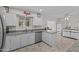 Spacious kitchen featuring granite countertops and white cabinets at 9890 N Balboa Dr, Sun City, AZ 85351