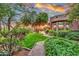 Landscaped backyard with a brick pathway and lush greenery at 10040 E Happy Valley Rd # 595, Scottsdale, AZ 85255