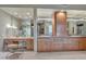 Elegant bathroom with double sinks, vanity, and a large mirror at 10040 E Happy Valley Rd # 595, Scottsdale, AZ 85255