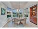 Bright breakfast nook with a round table and built-in shelving at 10040 E Happy Valley Rd # 595, Scottsdale, AZ 85255