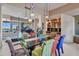 Bright dining room with glass table and colorful chairs, overlooking scenic views at 10040 E Happy Valley Rd # 595, Scottsdale, AZ 85255