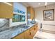 Modern kitchen with granite countertops and ample cabinetry at 10040 E Happy Valley Rd # 595, Scottsdale, AZ 85255