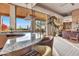 Wet bar with granite countertop and seating, overlooking scenic views at 10040 E Happy Valley Rd # 595, Scottsdale, AZ 85255