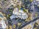 Aerial view of unique home, pool, and landscaping at 11077 E Cinder Cone Trl, Scottsdale, AZ 85262