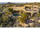 Luxury home with pool and desert landscaping; expansive views at 11077 E Cinder Cone Trl, Scottsdale, AZ 85262