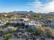 Aerial view of a unique home nestled in desert landscape at 11077 E Cinder Cone Trl, Scottsdale, AZ 85262