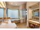 Spa-like bathroom with soaking tub, walk-in shower, and dual vanities at 11077 E Cinder Cone Trl, Scottsdale, AZ 85262