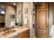 Bathroom with a single sink vanity and walk-in shower at 11077 E Cinder Cone Trl, Scottsdale, AZ 85262