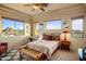 Bedroom with a queen-size bed and breathtaking views at 11077 E Cinder Cone Trl, Scottsdale, AZ 85262