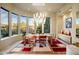 Elegant dining room with large windows and a modern chandelier at 11077 E Cinder Cone Trl, Scottsdale, AZ 85262