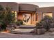 Elegant entryway with unique glass door and stone pathway at 11077 E Cinder Cone Trl, Scottsdale, AZ 85262