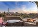 Outdoor firepit and patio furniture with scenic desert views at 11077 E Cinder Cone Trl, Scottsdale, AZ 85262