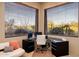 Sunlit home office with corner desk and window views at 11077 E Cinder Cone Trl, Scottsdale, AZ 85262