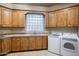 Laundry room with washer, dryer, and ample cabinetry at 11077 E Cinder Cone Trl, Scottsdale, AZ 85262