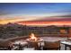 Stunning sunset views from this backyard patio with firepit at 11077 E Cinder Cone Trl, Scottsdale, AZ 85262