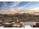 Scenic patio with fire pit and mountain views at 11077 E Cinder Cone Trl, Scottsdale, AZ 85262