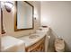 Elegant powder room with granite vanity and decorative mirror at 11077 E Cinder Cone Trl, Scottsdale, AZ 85262