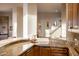 Wet bar with granite countertop and wood cabinetry at 11077 E Cinder Cone Trl, Scottsdale, AZ 85262