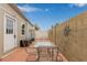 Small backyard patio with seating area and block wall at 111 S Greenfield Rd # 827, Mesa, AZ 85206