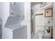 Small bathroom with shower, toilet, and stackable washer/dryer at 111 S Greenfield Rd # 827, Mesa, AZ 85206