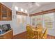 Bright dining area with wood floors and yellow table set at 111 S Greenfield Rd # 827, Mesa, AZ 85206