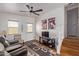 Living room with wood floors, TV, and comfortable seating at 111 S Greenfield Rd # 827, Mesa, AZ 85206