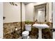 Elegant powder room with pedestal sink and mosaic tile at 13007 W Lowden Rd, Peoria, AZ 85383