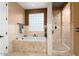 Spa-like bathroom with soaking tub and walk-in shower at 13007 W Lowden Rd, Peoria, AZ 85383