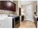 Bright laundry room with ample cabinetry and storage at 13007 W Lowden Rd, Peoria, AZ 85383