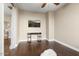 Home office with wood floors and a modern media console at 13007 W Lowden Rd, Peoria, AZ 85383