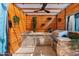 Modern outdoor kitchen with stone counters, built-in grill, and wood accents at 13007 W Lowden Rd, Peoria, AZ 85383