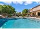 Inviting pool with waterfall feature and ample patio space at 13007 W Lowden Rd, Peoria, AZ 85383