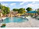 Inviting backyard oasis with a sparkling pool and waterfall feature at 13007 W Lowden Rd, Peoria, AZ 85383