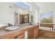 Bright and airy bathroom with double sinks, a spacious shower, and a separate bathtub for relaxation at 13248 N 12Th Pl, Phoenix, AZ 85022