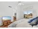 Relaxing bedroom with ensuite bathroom access and a scenic view of the outdoor landscape and pool at 13248 N 12Th Pl, Phoenix, AZ 85022