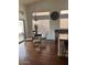 Bright dining area with a glass table and four chairs, adjacent to the kitchen at 13248 N 12Th Pl, Phoenix, AZ 85022