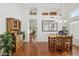 Dining room showcasing hardwood floors, a rustic wooden table, and charming decor at 13248 N 12Th Pl, Phoenix, AZ 85022