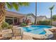 Backyard with a pool, desert landscaping, a covered patio, and a seating area at 13248 N 12Th Pl, Phoenix, AZ 85022