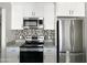 Modern kitchen featuring stainless steel appliances and granite countertops at 1342 W Emerald Ave # 344, Mesa, AZ 85202