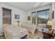 Bright guest bedroom with two twin beds and ample natural light at 13442 W Blackstone Ln, Peoria, AZ 85383