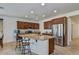 Island kitchen with stainless steel appliances and granite countertops at 13442 W Blackstone Ln, Peoria, AZ 85383