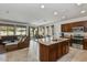 Open floor plan with kitchen island and spacious living room at 13442 W Blackstone Ln, Peoria, AZ 85383