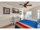 Bedroom featuring tile flooring, ceiling fan, double hung windows, and a dresser at 14615 N 28Th St, Phoenix, AZ 85032