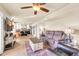 Open-concept living room flowing into the kitchen, featuring comfortable seating and bright natural light at 14615 N 28Th St, Phoenix, AZ 85032