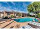 Inviting backyard pool with lounge chairs and a covered patio, perfect for outdoor relaxation and entertainment at 14615 N 28Th St, Phoenix, AZ 85032