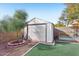 Backyard with storage shed and artificial turf at 14885 W Caribbean Ln, Surprise, AZ 85379