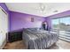 Bedroom with a double bed and purple walls at 14885 W Caribbean Ln, Surprise, AZ 85379